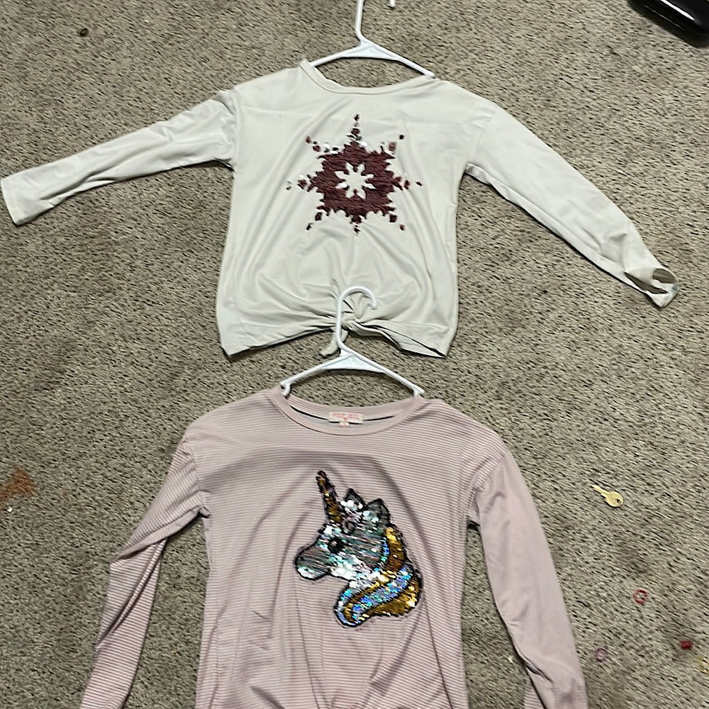 Two shirts from Poof girls wore a few times $10 The size is M in kids